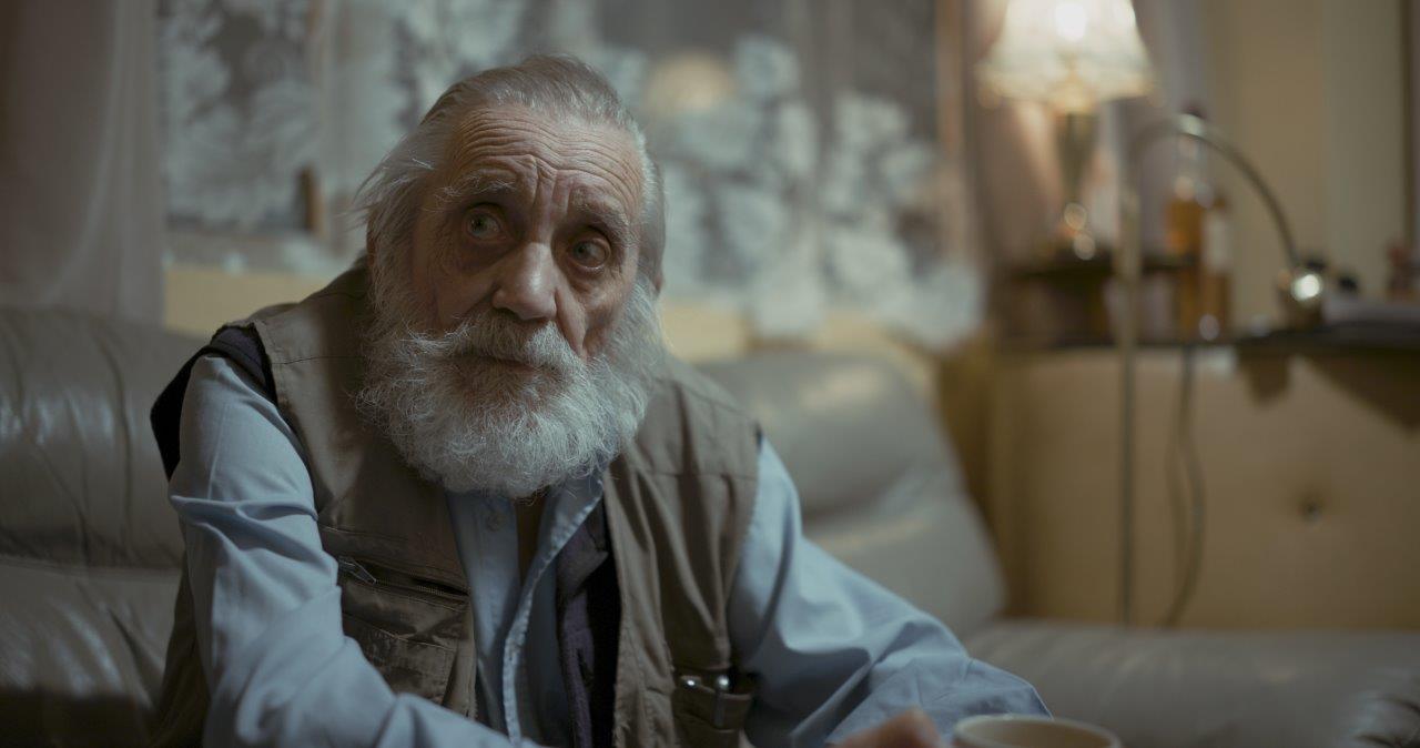 Blind veteran Ken sitting staring in to distance